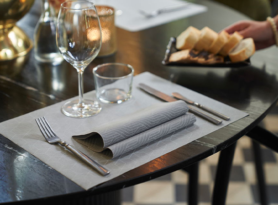 Towel napkins on a restaurant two-seater table