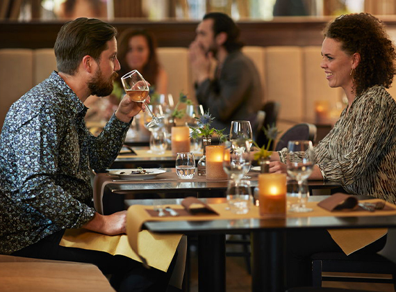 Couple dining at a hotel restaurant in the evening